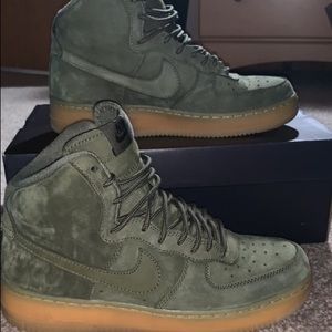 Olive green Nike high top tennis shoes